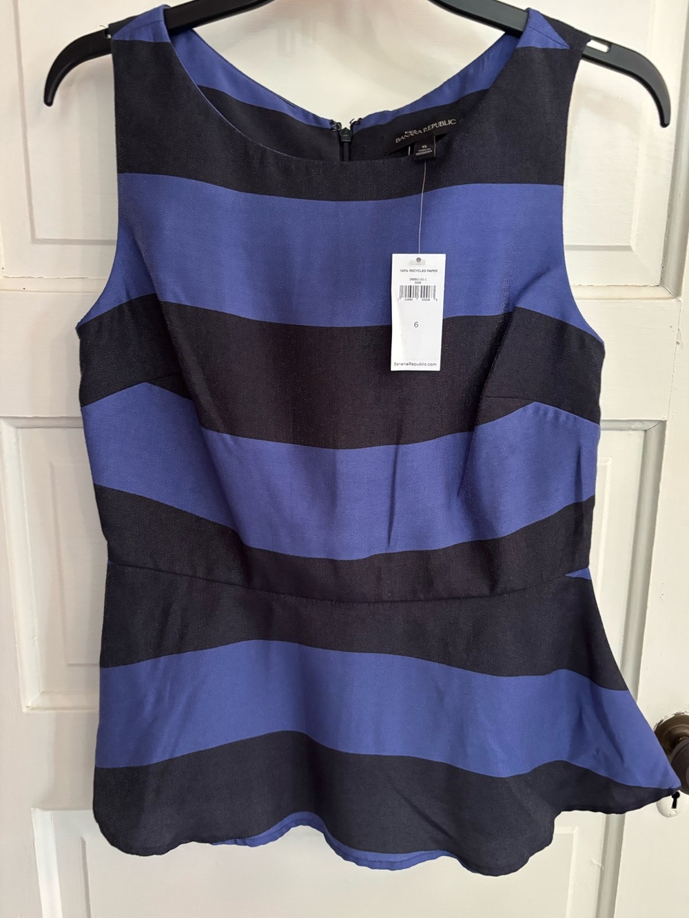 Banana Republic black/ blue striped shirt. Sleeveless, peplum like flare. NWT